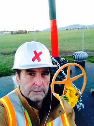 Ken Ward shutting off a valve on Kinder Morgan’s Trans Mountain Pipeline in October.Courtesy of Ken Ward